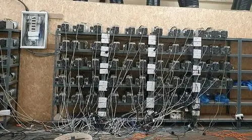 Image of a mining rig highlighting the complex hardware involved.